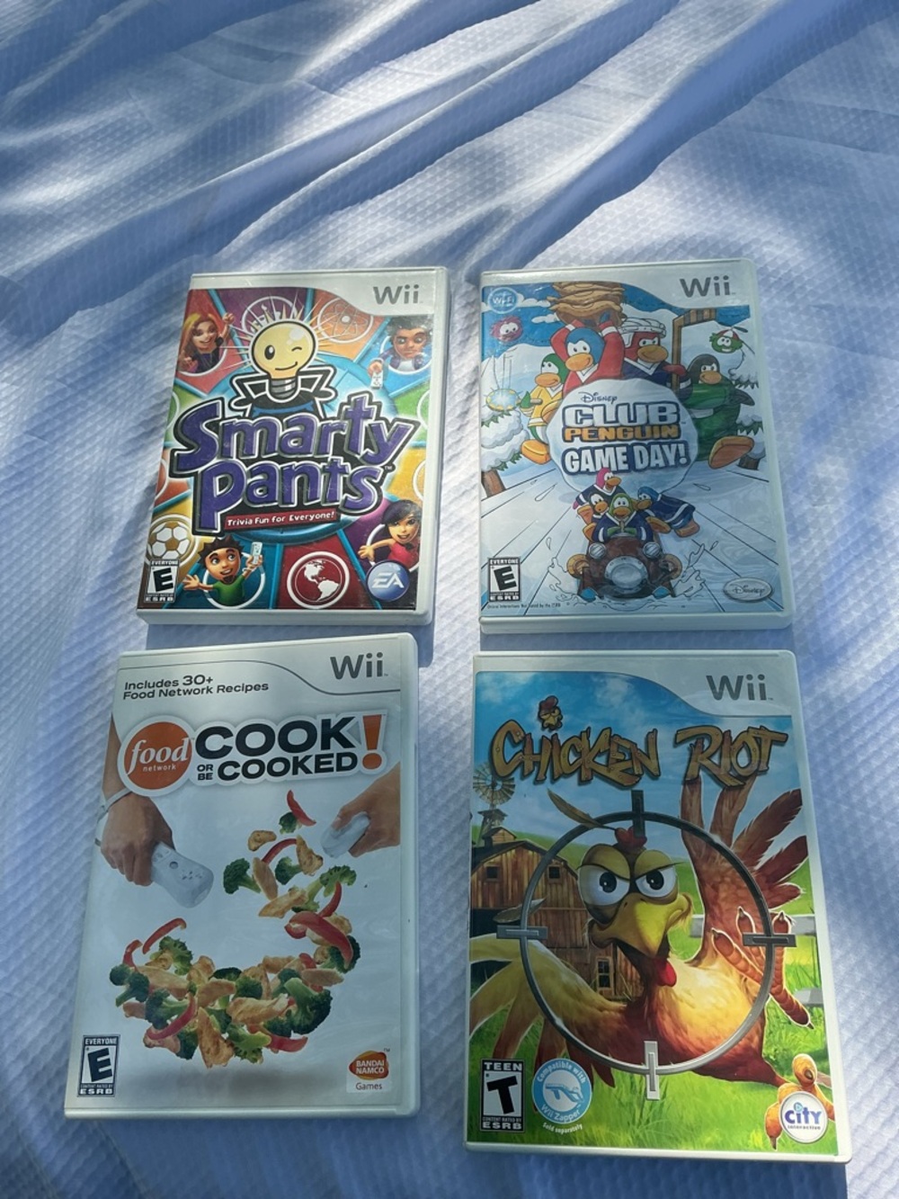 Lot of 4 Wii video games and cook . Used .